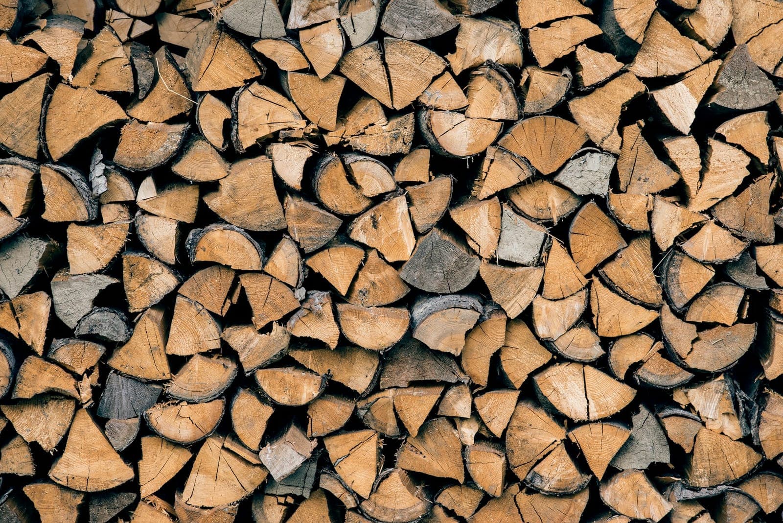 Stacked split firewood ready for the smoker